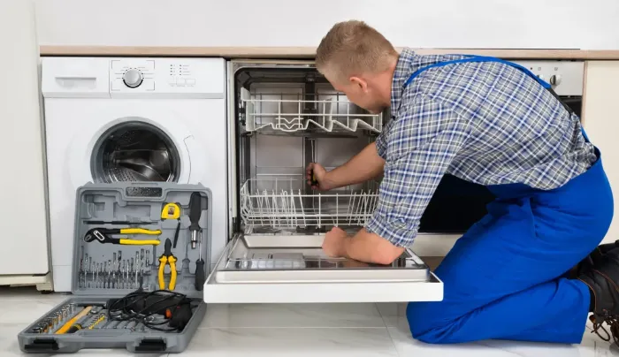 Technician is fixing Dishwasher