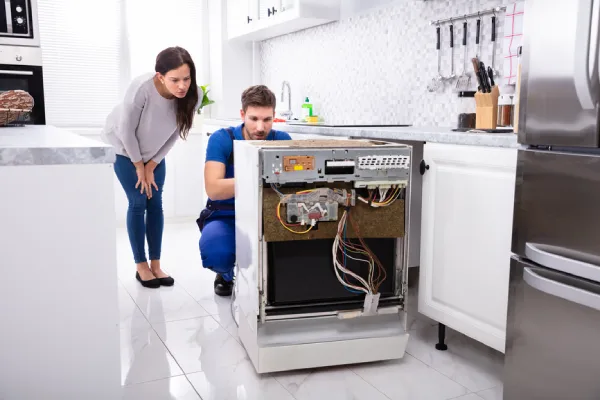 Technician is fixing Dryer