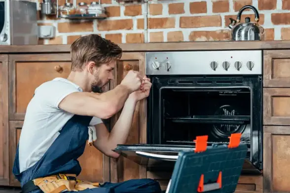 Technician is fixing Oven