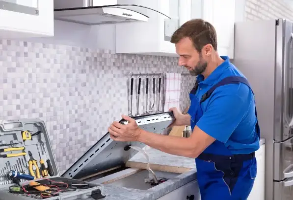 Technician is fixing Cooktop